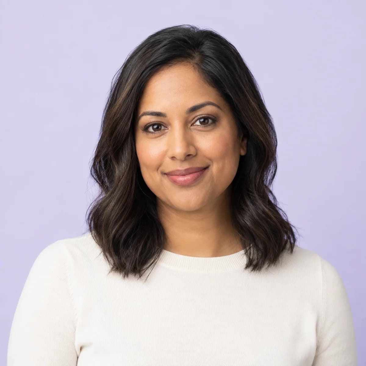 Studio portrait of an adult woman on a lavender background